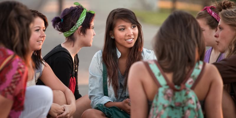 A group of teen girls talking together